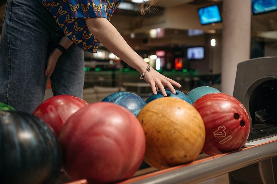 Where do you put your fingers in a bowling ball