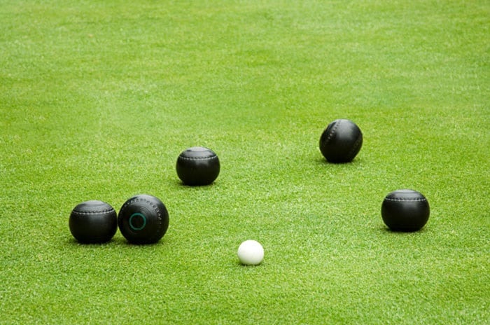 Bocce and Lawn bowling have different playing surfaces